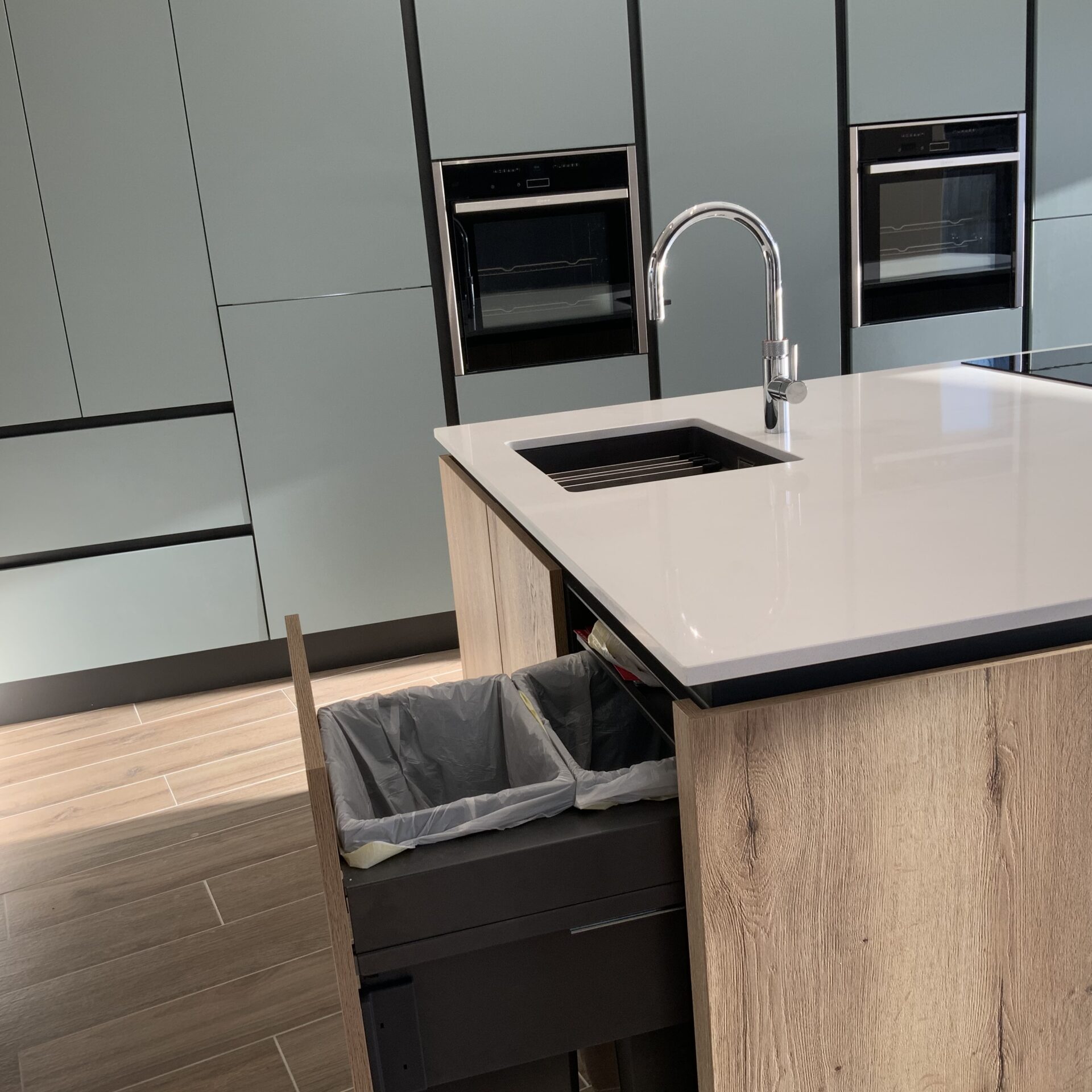 Island in mid blue and oak effect kitchen in Milton Keynes Kitchen Island in Family Kitchen in Milton Keynes